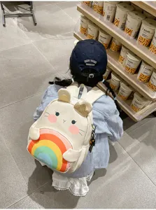 Cute cartoon animal children backpack with colorful rainbow pocket and crown detail for kids.