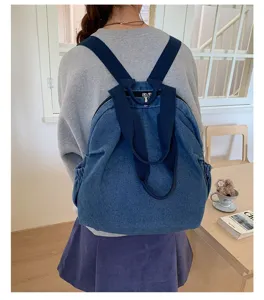 Sac à dos multifonctionnel en denim lavé vintage pour femmes, grande capacité.