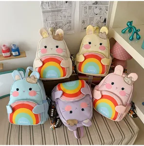 Cute kids rainbow bunny backpack multi-color set, rabbit design with vibrant rainbow pocket.