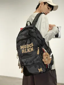 Stylish camouflage student backpack with large capacity, durable and comfortable for school.