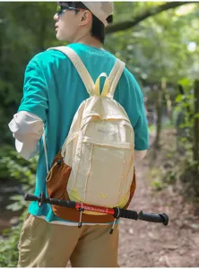Outdoor casual nylon backpack in contrast color with elastic strap, detailed shot.