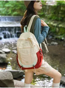 Casual outdoor nylon backpack with multi-pocket design, stylish student daypack for travel.