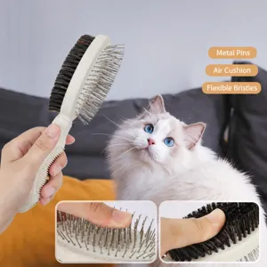 Pet double-sided grooming comb with metal pins and soft bristles for daily pet care.