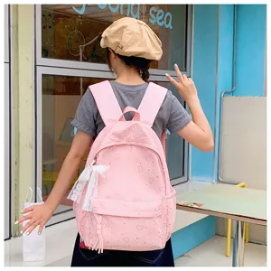 Joli sac à dos style japonais avec imprimé cœur rose et nœud en dentelle détail.