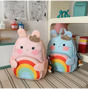 Cute cartoon animal children backpack detail view with sweet rainbow design and crown.
