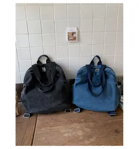 Sac a dos multifonctionnel en denim lave retro pour femmes pour le transport quotidien.