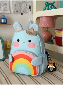 Cute cartoon blue rabbit backpack detail with colorful rainbow front pocket and shiny crown.