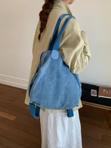 Sac à dos multifonctionnel en denim lavé rétro et sac bandoulière pour femmes quotidien.