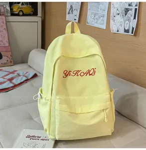 Stilvoller gelber Segeltuch-Schulrucksack mit roter Stickerei, lässiger Tagesrucksack für Schüler.