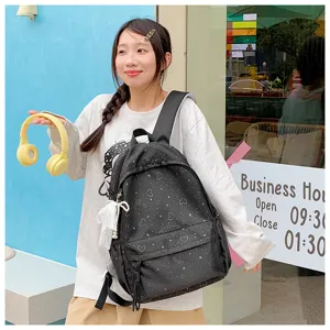 Sac à dos d'école pour filles avec motif de cœur style Harajuku mignon grande capacité détail.