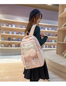 Joli sac à dos d'étudiant rose colorblock avec poche avant et pochette ronde assortie.
