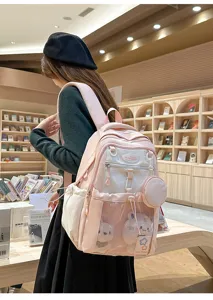 Sac à dos d'école pour étudiant bicolore rose avec peluches mignonnes dans la poche filet.