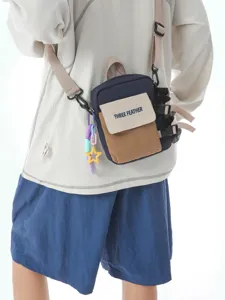 Sac bandoulière tactique tendance en blocs de couleurs pour la randonnée et le quotidien.