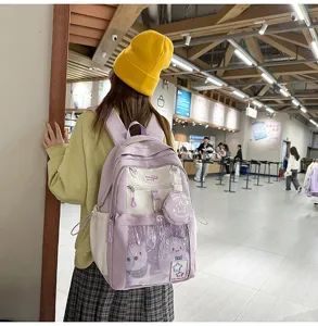 Sac à dos d'étudiant coloré et mignon avec une grande capacité et une poche transparente.