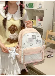 Mochila escolar rosa con lunares, bolsillo transparente delantero y bonito colgante de estrella.