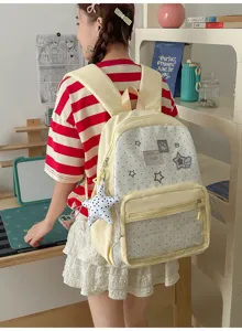 Mochila de lona amarilla con lunares, bolsillo transparente y colgante de estrella.