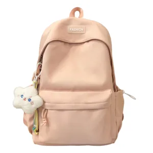 Zaino casual in nylon rosa per studenti, grande capacità borsa scolastica carina con ciondolo.