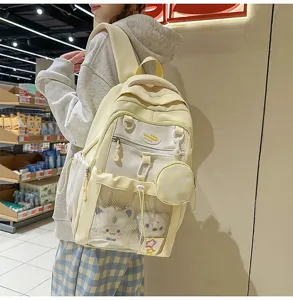 Grand sac à dos pour étudiant au design contrasté mignon, poche filet et petite pochette.