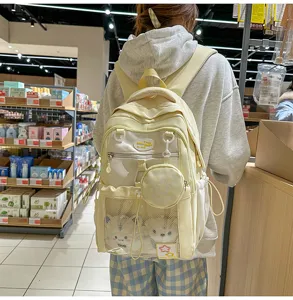 Sac à dos scolaire mignon colorblock grande capacité avec petite pochette adorable.