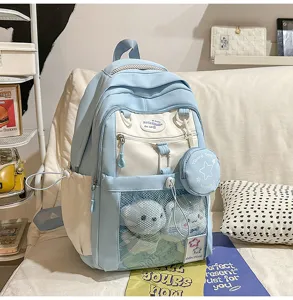 Sac à dos d'écolier colorblock mignon de grande capacité avec jolie poche en peluche.