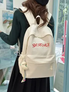 Minimalistischer Canvas Schulrucksack für Damen und Schüler mit cooler Buchstabenstickerei.