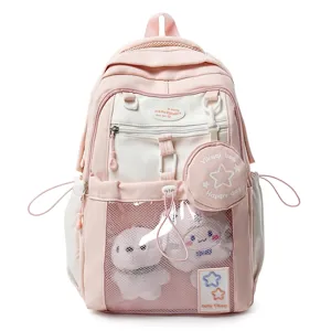 Joli sac à dos scolaire rose avec une grande capacité et une poche avant en maille.