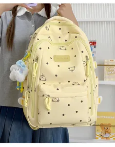 Mochila bonita de lunares con dibujos animados y gran capacidad para estudiantes y uso diario.