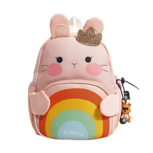 Cute pink rabbit backpack for kids with rainbow and bear pendant, ideal for school.