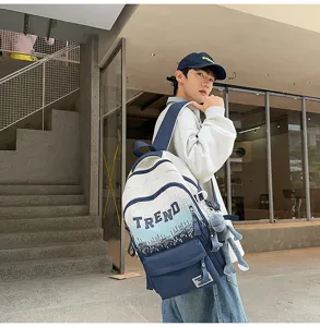 Detail view of large capacity gradient letter backpack with stylish color blocking design.