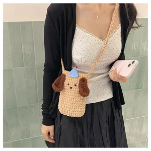 Handmade crochet cute dog phone bag detail, cozy knit crossbody strap, daily travel essential.