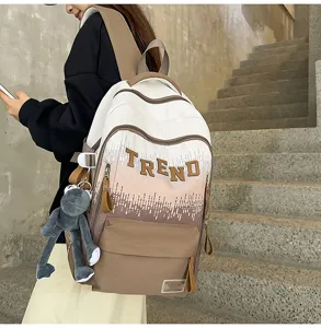 Stylish gradient letter backpack with large capacity for student school use. Trendy design.