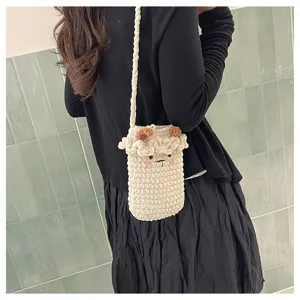 Handmade crochet cute sheep phone bag detail shot, crossbody shoulder mini knit bag for women.