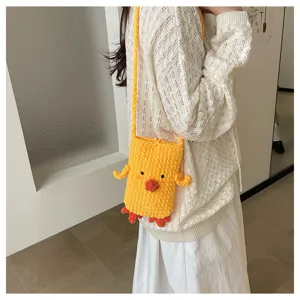 Handmade knit cute chick crossbody phone bag detail view, soft cozy yellow yarn chic accessory.