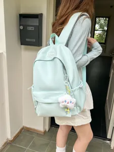 Zaino da studente in nylon color caramella di grande capacità, stile fresco per uso quotidiano.
