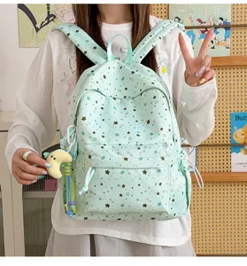 Cute mint green star print canvas backpack for students, casual lightweight school bag.