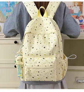 Cute yellow star print school backpack with large capacity, multiple pockets and side storage.