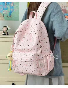 Pink star print school backpack for students, cute daily casual bookbag with large capacity.
