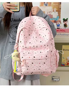 Pink star print school backpack for students, large capacity lightweight casual daily book bag.