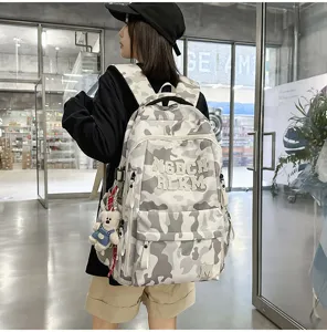 Fashionable camo backpack for women, large capacity school bag with multi-compartments.