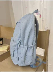 Hellblauer Schüler-Rucksack mit silbernem Sternen-Druck, große Kapazität und leichte Alltagstasche.