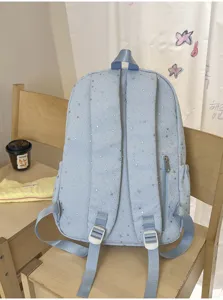 Süßer hellblauer Schulrucksack mit silbernen Sternen, leicht und lässig für Studenten.