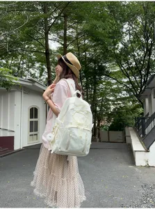 Japanese minimalist large capacity white school backpack for students, stylish and versatile.