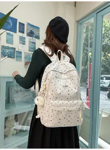Sac à dos style collège motif étoiles avec plusieurs compartiments pour les étudiants.
