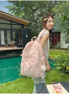 Japanese style pink student backpack with drawstring and large capacity for daily use.