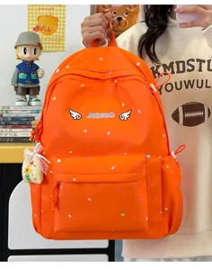 Niedlicher orangefarbener Schulrucksack mit Punkten fuer Maedchen taeglicher Gebrauch.