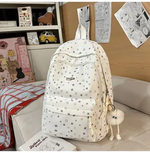 Sac à dos d'école imprimé étoiles mignon avec multi-compartiments et grande capacité.