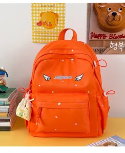 Japanischer süßer oranger gepunkteter Rucksack mit gestickten Flügeln für Schüler Alltag Schule