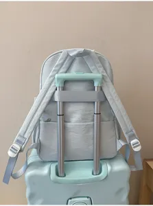 Light blue student backpack detail, back view with luggage strap design for travel convenience.