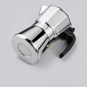 Stainless steel moka pot detail view showing polished metallic finish and ergonomic handle.