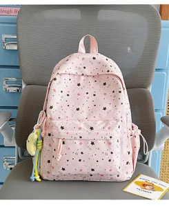 Pink star print student backpack detail shot, lightweight large capacity school bag.